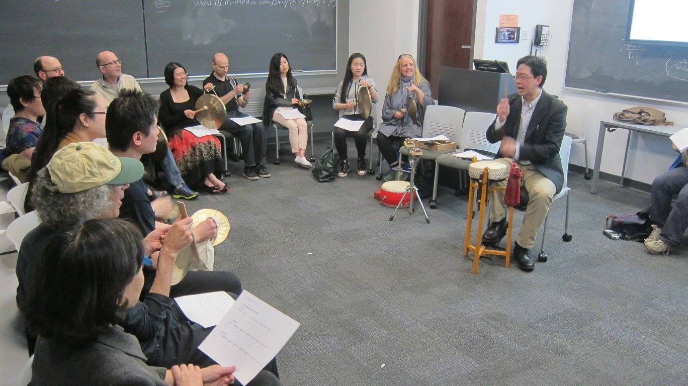 Po-Wei Weng leading a participatory Peking Opera percussion workshop